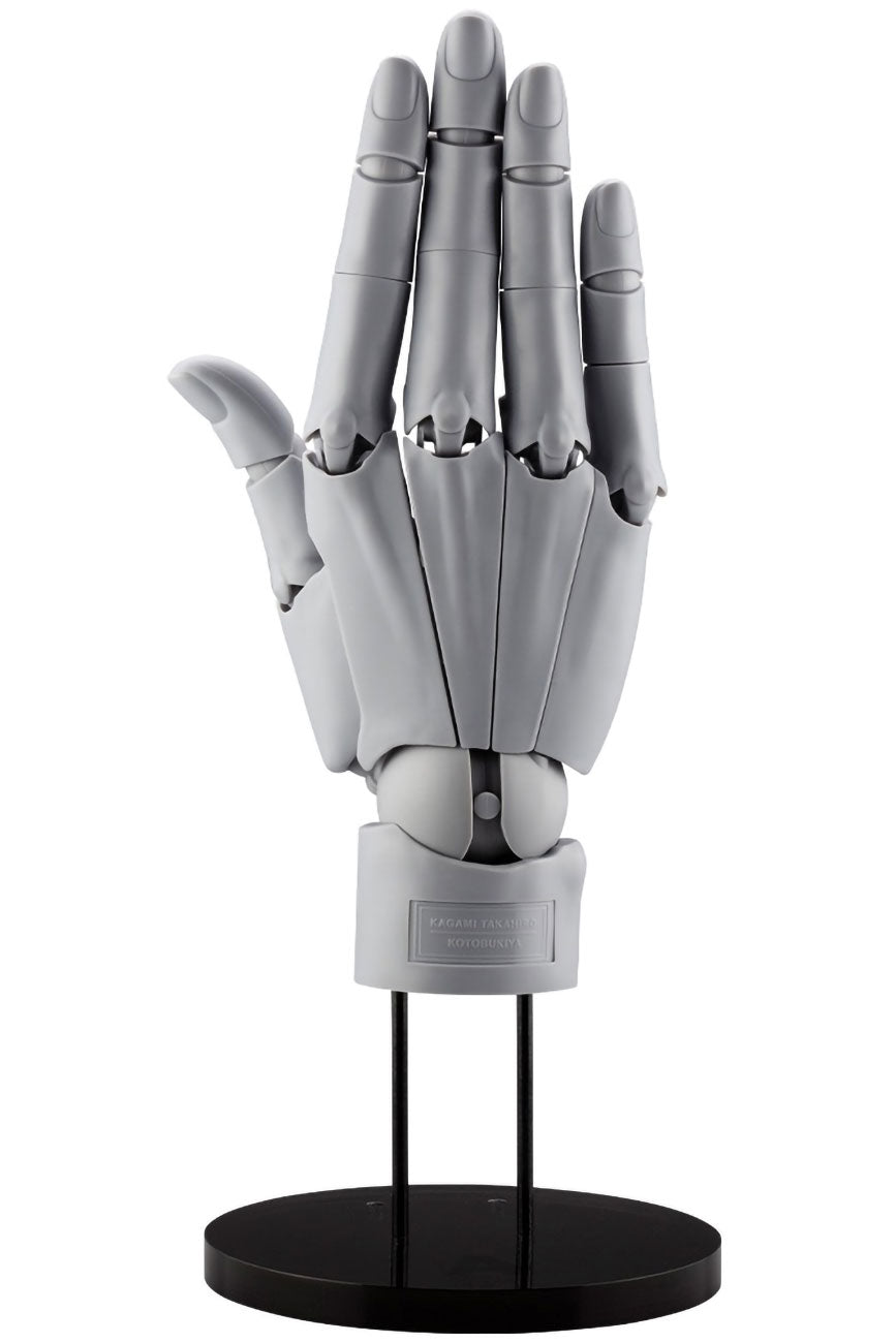 Gray mechanical hand model on a black stand against a white background
