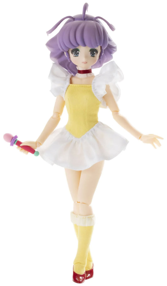 Toy figure with purple hair and a yellow outfit on a white background