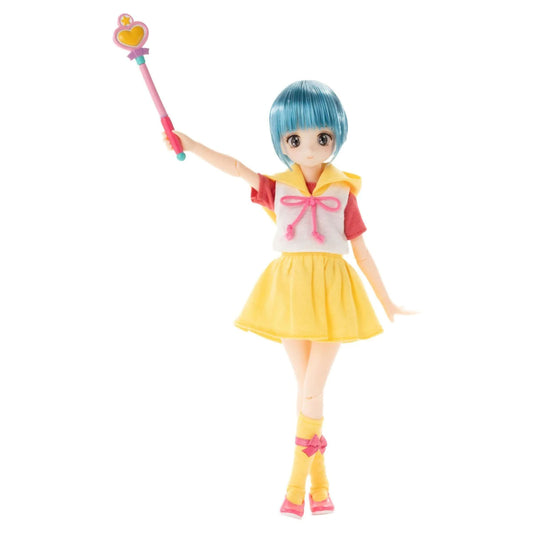 Yuu Morisawa from Creamy Mami, the Magic Angel doll with short blue hair, wearing a yellow skirt, white top with red sleeves, and pink bow details, holding a pink and yellow wand against a plain white background.