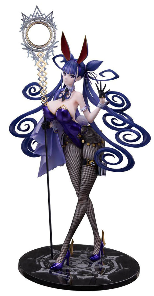 A detailed anime figurine of a female character with blue hair and bunny ears, wearing a purple and black outfit with fishnet stockings, holding a large ornate staff, and standing on a circular base against a white background.