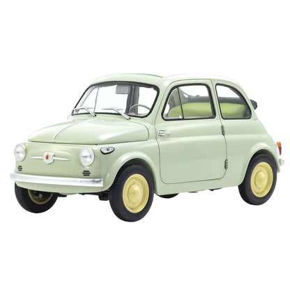 A miniature model of a classic Fiat 500 car in a pale sage green color, featuring yellow wheels and a small Fiat crest on the front grille, set against a plain white background.