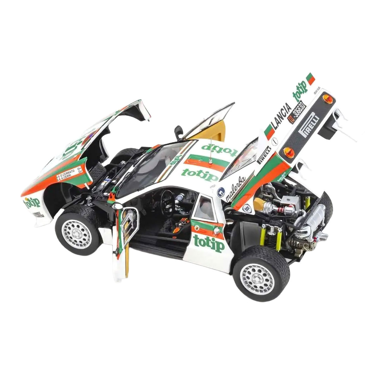 A detailed model of a Lancia rally car with its doors and hood open, showcasing the interior and engine. The car is primarily white with green and orange sponsor decals, including Totip and Pirelli.