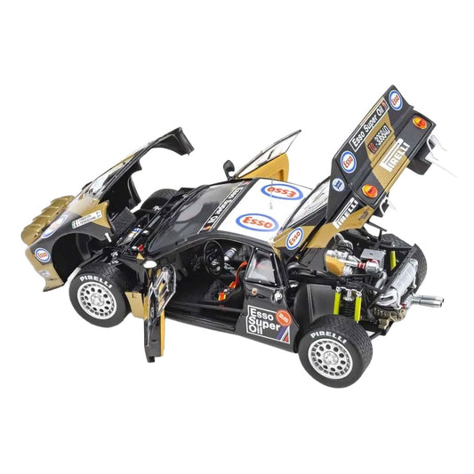 A detailed model of a Lancia Rally 037 1985 Targa Florio #3 with its doors and hood open, showcasing a black and gold body with various sponsor decals including Esso and Pirelli, set against a plain white background.