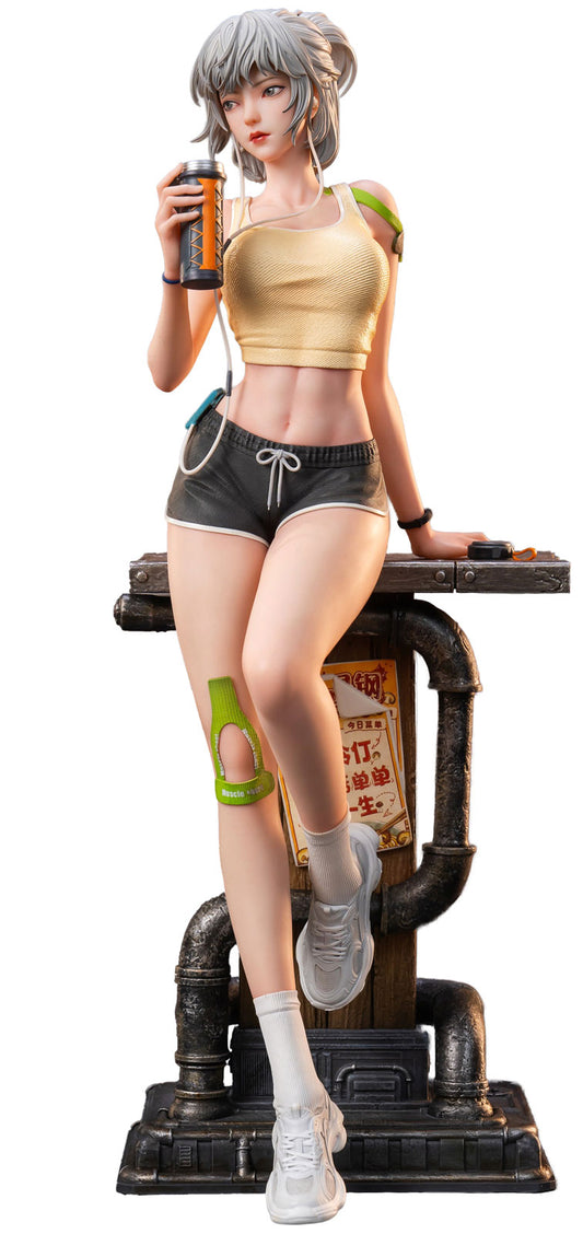 Statue of a character in a yellow top and black shorts with a drink, standing on a platform with pipes and posters.