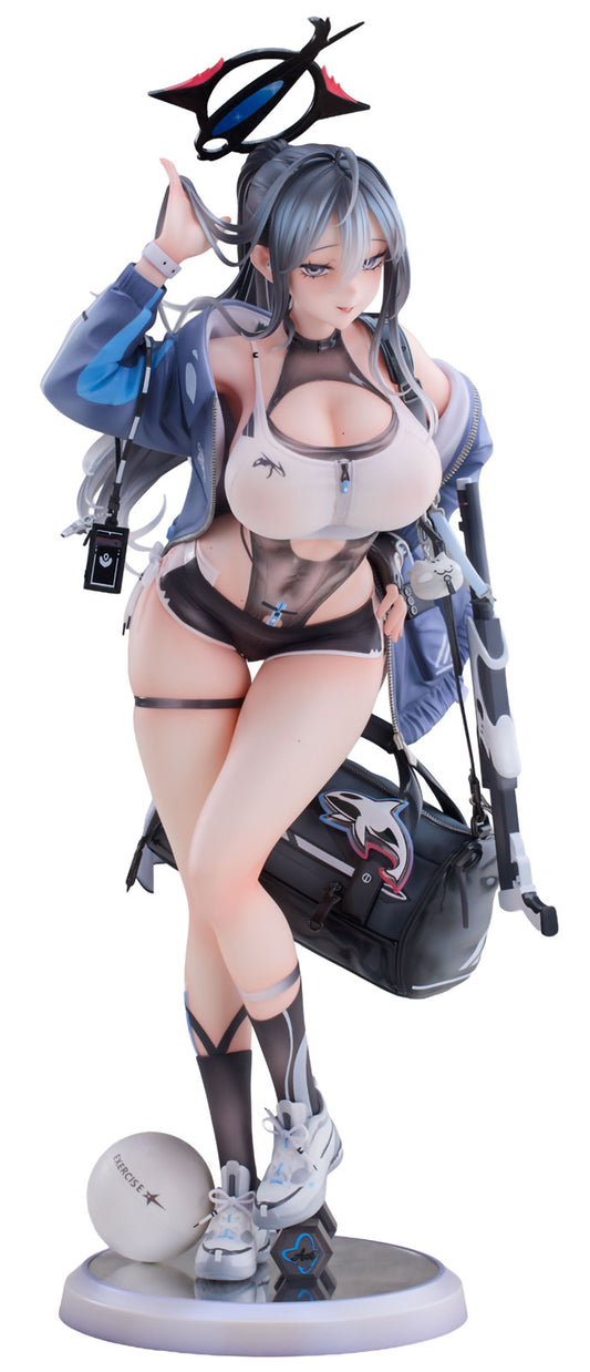 A detailed anime figurine of MADAENG Kana with blue-gray hair, wearing a blue jacket, sheer crop top, black underwear, thigh straps, and high socks, posed on a round base with a bag and headset against a white background.
