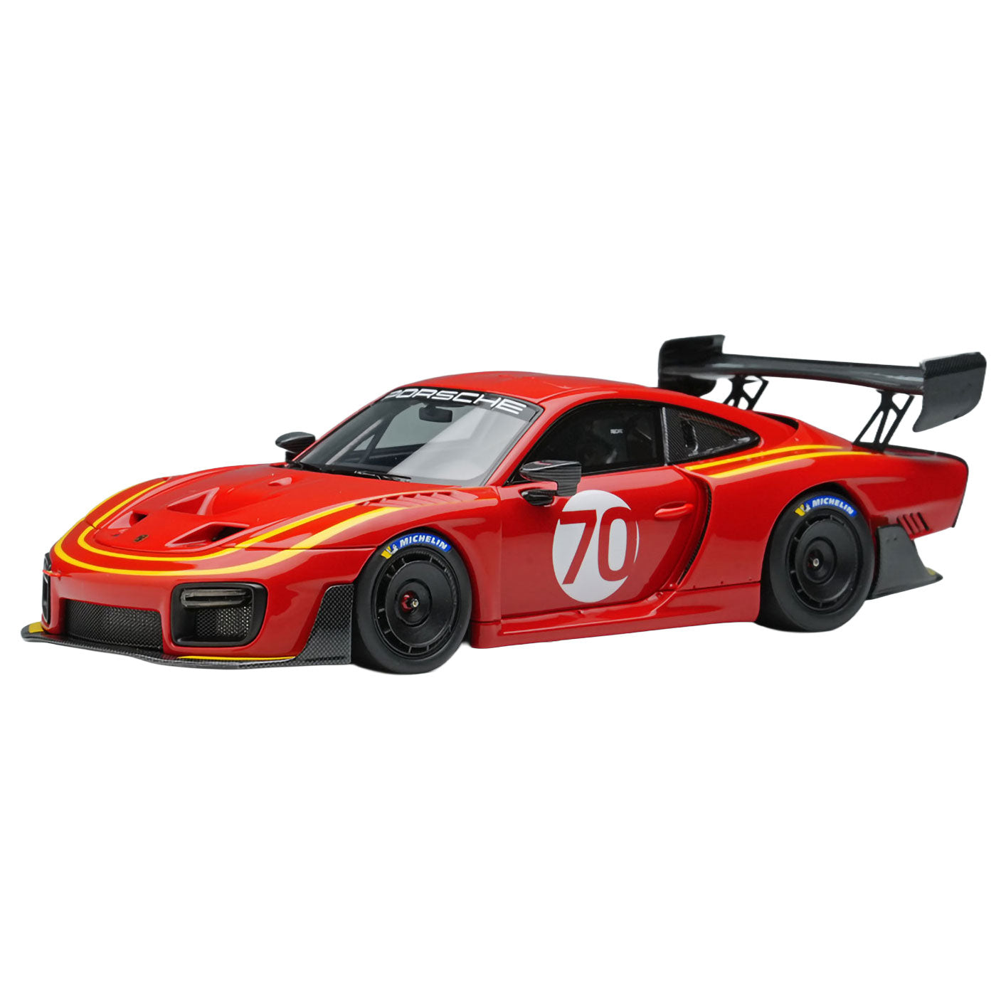 A red Porsche 935/19 2019 race car model with yellow decals, a large rear wing, and the number 70 on the side door, shown on a plain white background.