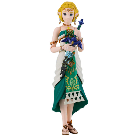 A collectible figurine of Princess Zelda from The Legend of Zelda, standing and holding the Royal Sword. She has blonde hair, a white and green dress with gold patterns, and brown sandals, set against a plain white background.