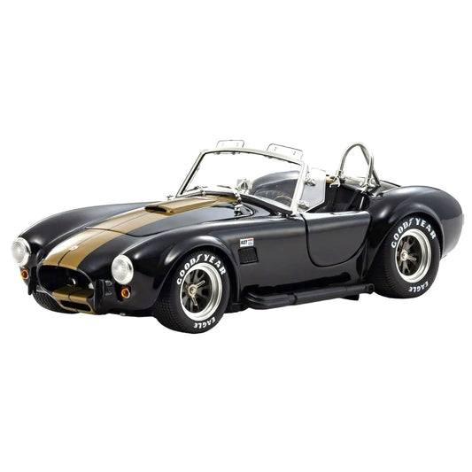 Diecast model car of Shelby Cobra 427S/C on a white background