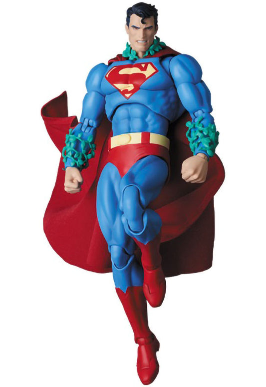 Superman action figure with red cape and blue suit on a white background