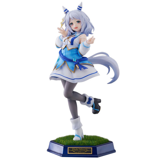 A collectible anime figurine of the character Hishi Miracle from Umamusume: Pretty Derby, posed mid-dance on a grassy base. The figure features light blue hair, a blue and white dress, gray tights, and black shoes, set against a plain white background.