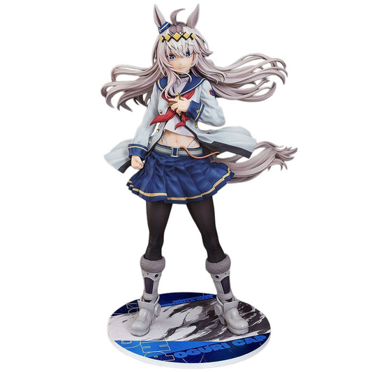 A detailed anime figurine of Oguri Cap from Umamusume with long silver-gray hair, wearing a white jacket, blue skirt, and black tights, standing on a round display base against a plain white background.